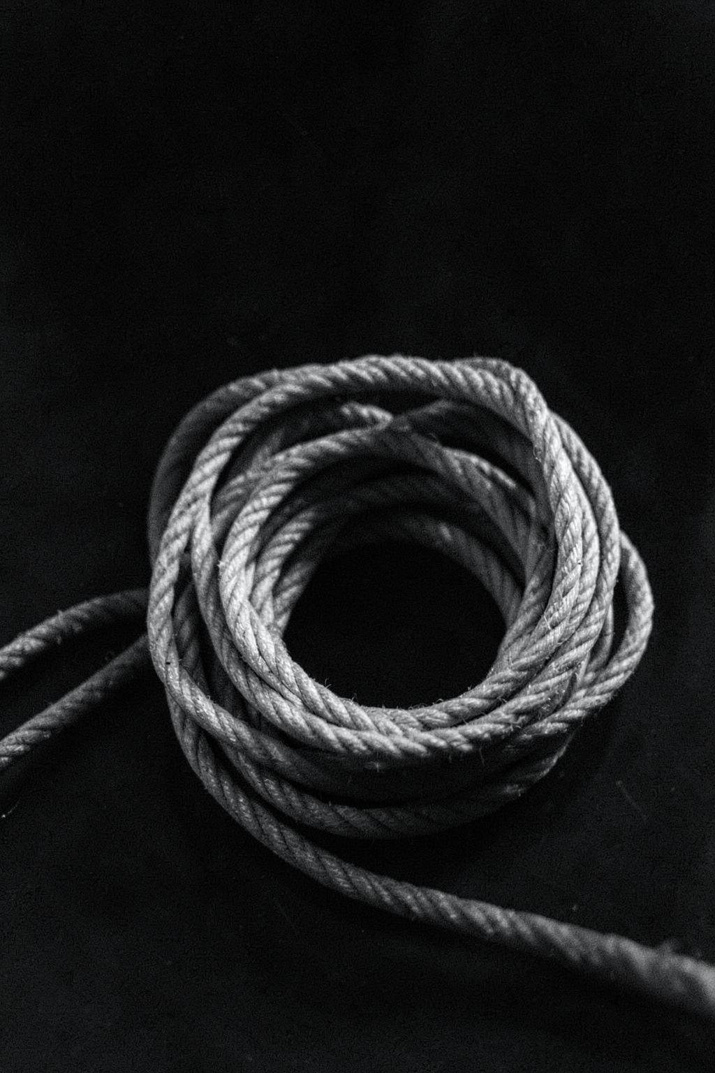 Coiled rope unwinding, monochrome close-up